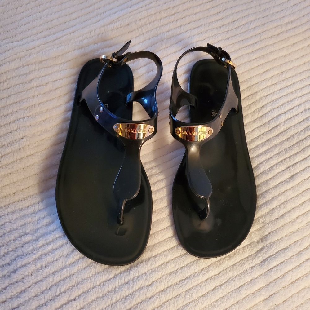 Dark Brown Michael Kors Jelly sandals size 6. Gently used, no scratches on plate